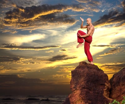 Man karate on cliff