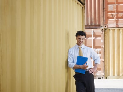 Man leaning on cargo container