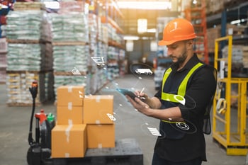 Supply chain worker in warehouse planning deliveries